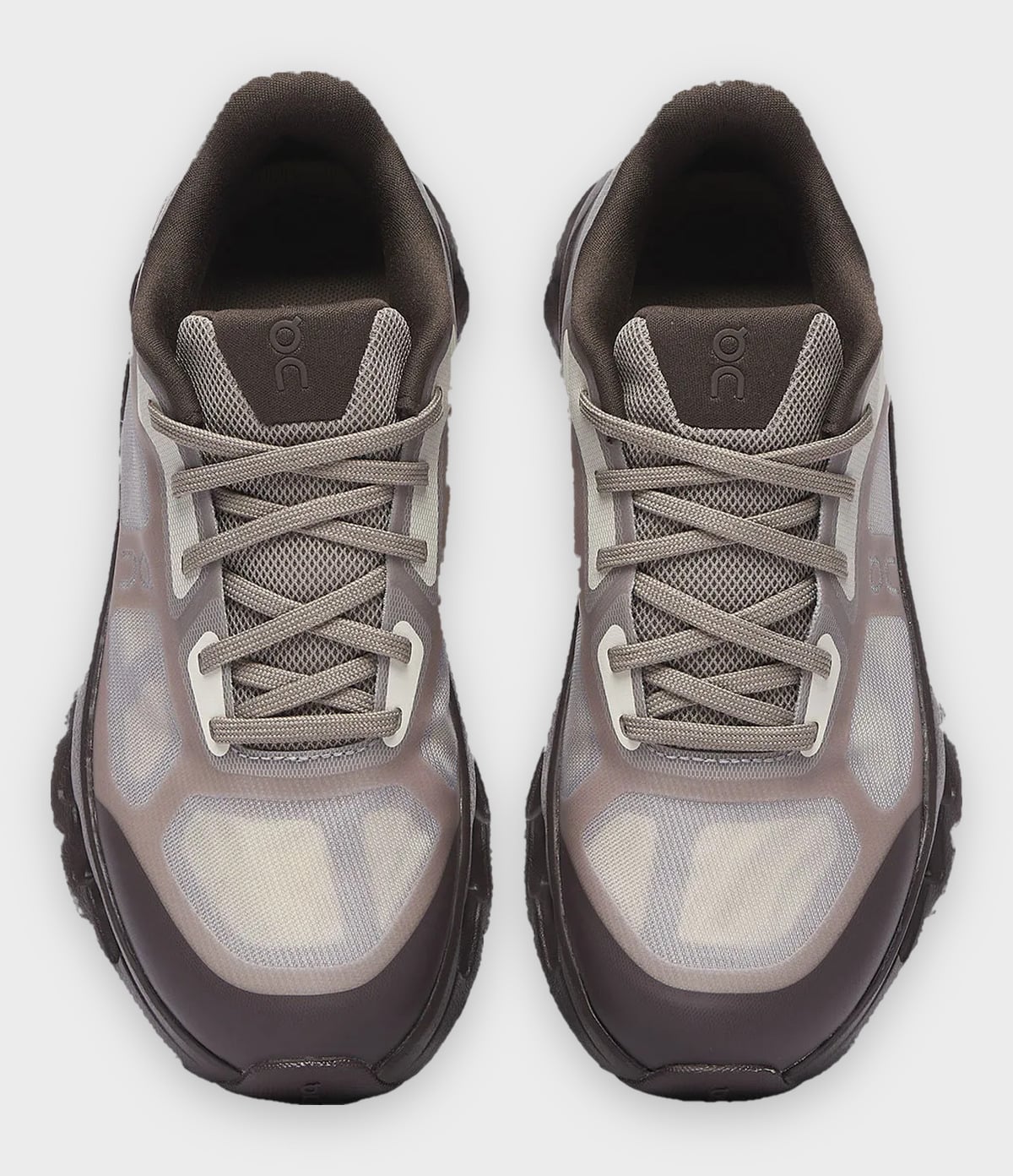 Top-down pair, brown runners with crisscross taupe laces and translucent toe panels, Burna Boy Collection