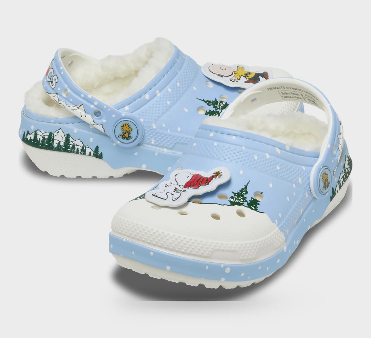 Pair of light blue clogs with white toes, cream fleece, charms with yellow shirt and red scarf, Classic Lined Clog