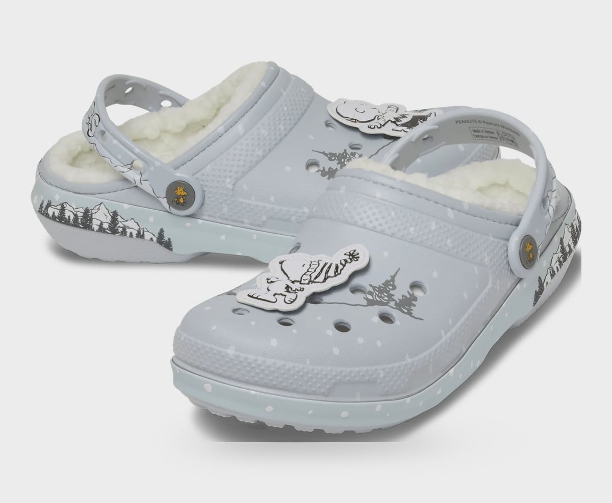 Pair of grey clogs with fleece lining, monochrome cartoon charms, mountain scene on the side, Classic Lined Clog