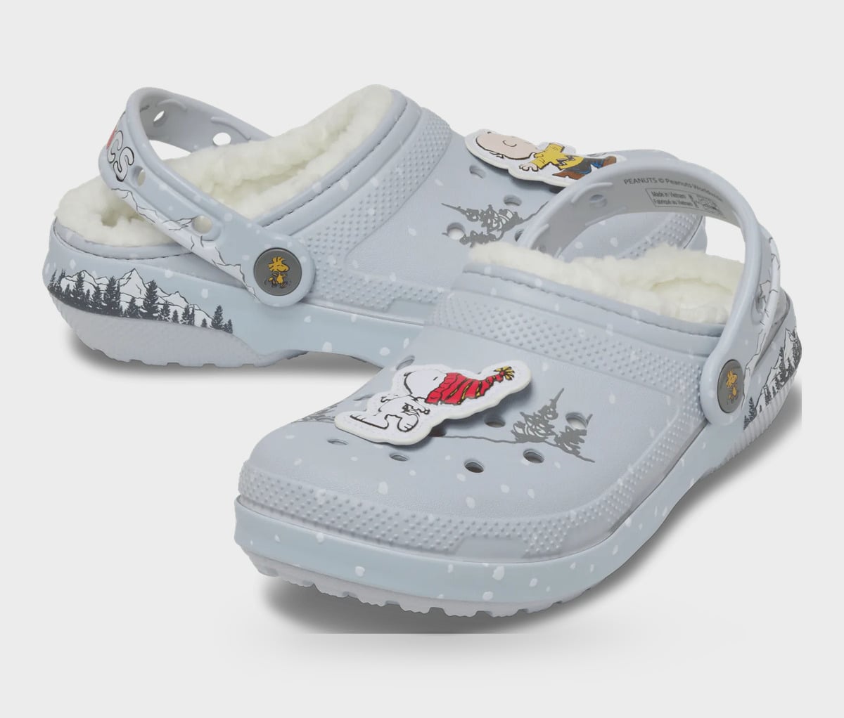 Pair of grey clogs, cream fleece lining, cartoon charms with yellow shirt and red scarf, snow dots, Classic Lined Clog