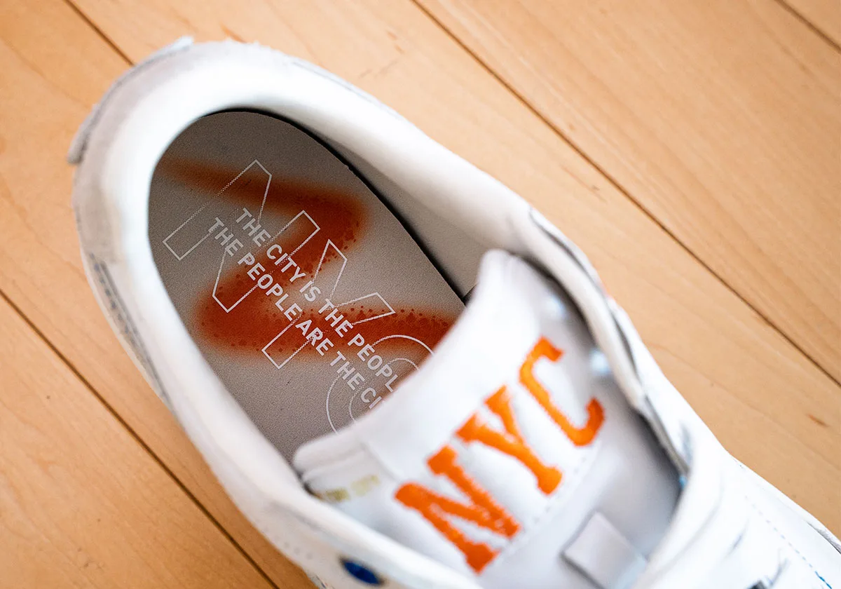 Insole detail with orange spray paint and white text, plus orange NYC tongue embroidery, Ceremony