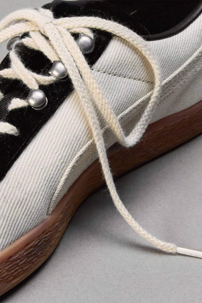 Close-up of lateral side with cream laces, silver studs eyelets, twill upper, gum sole, IVORYxBLACK