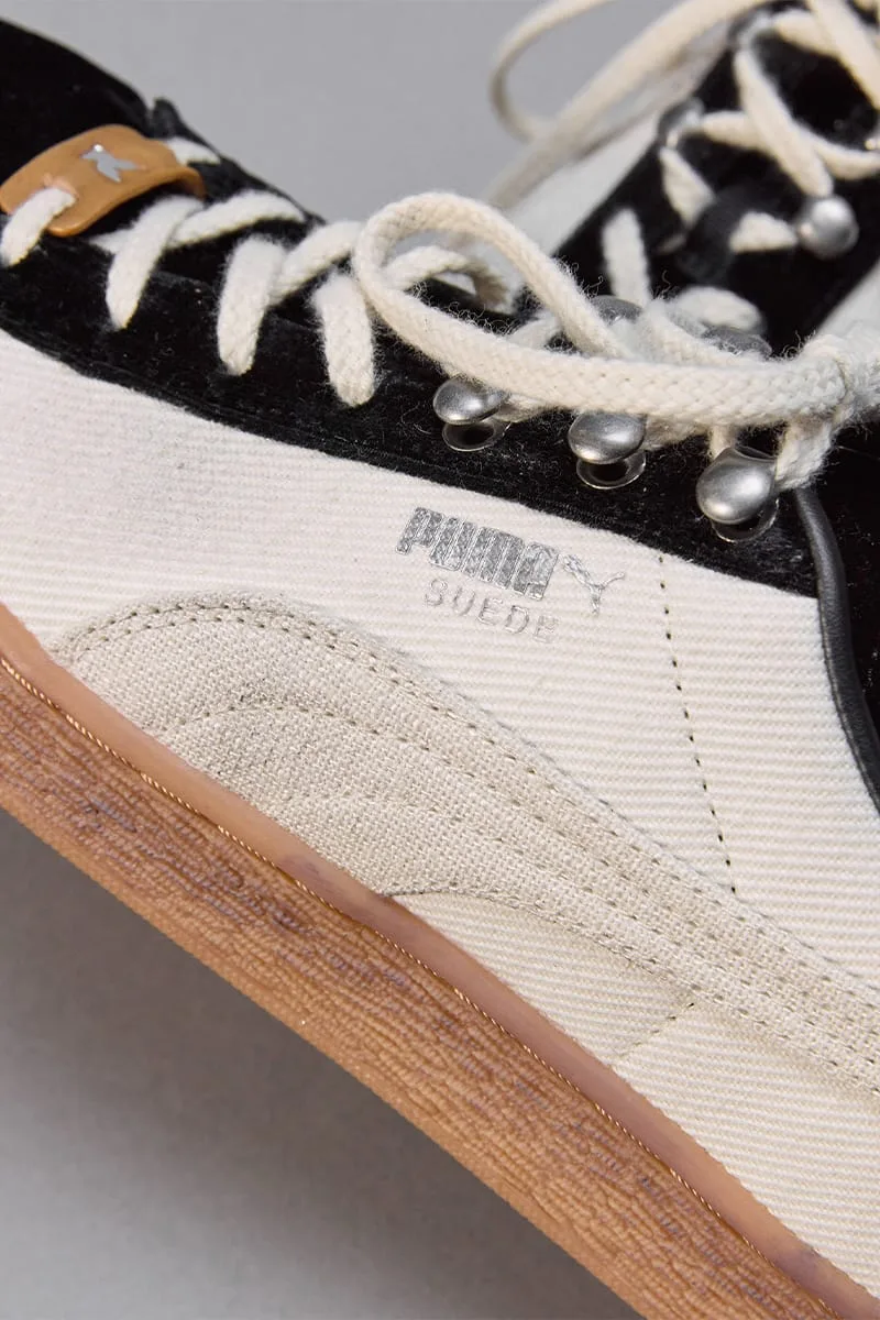 Lateral detail of silver PUMA Suede text, cream formstripe, black suede, tan lace tab, IVORYxBLACK