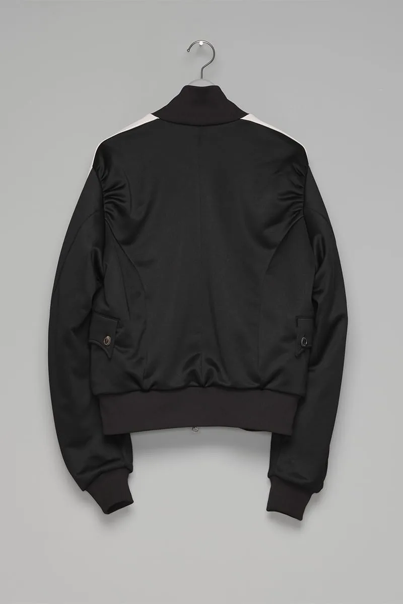 Black track jacket on hanger, back view, cream shoulder stripes, ribbed hem, flap pockets, IVORYxBLACK