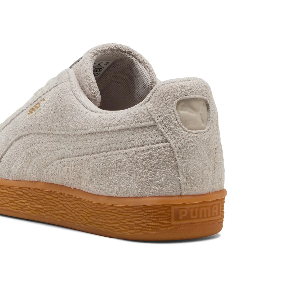 Heel detail of off-white suede with a tonal cat logo and gum sole, Forever