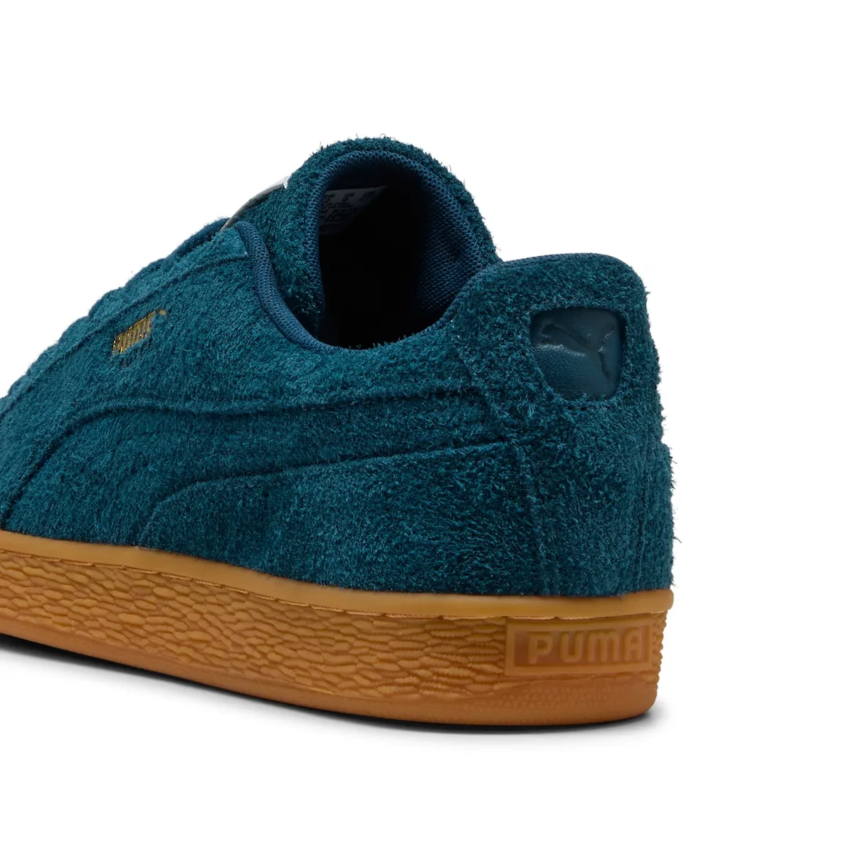 Heel detail of teal shaggy suede with a tonal cat logo and gum sole, Forever