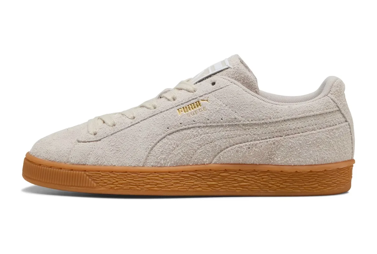 Lateral view of off-white suede with gold Puma branding and a gum sole, Forever