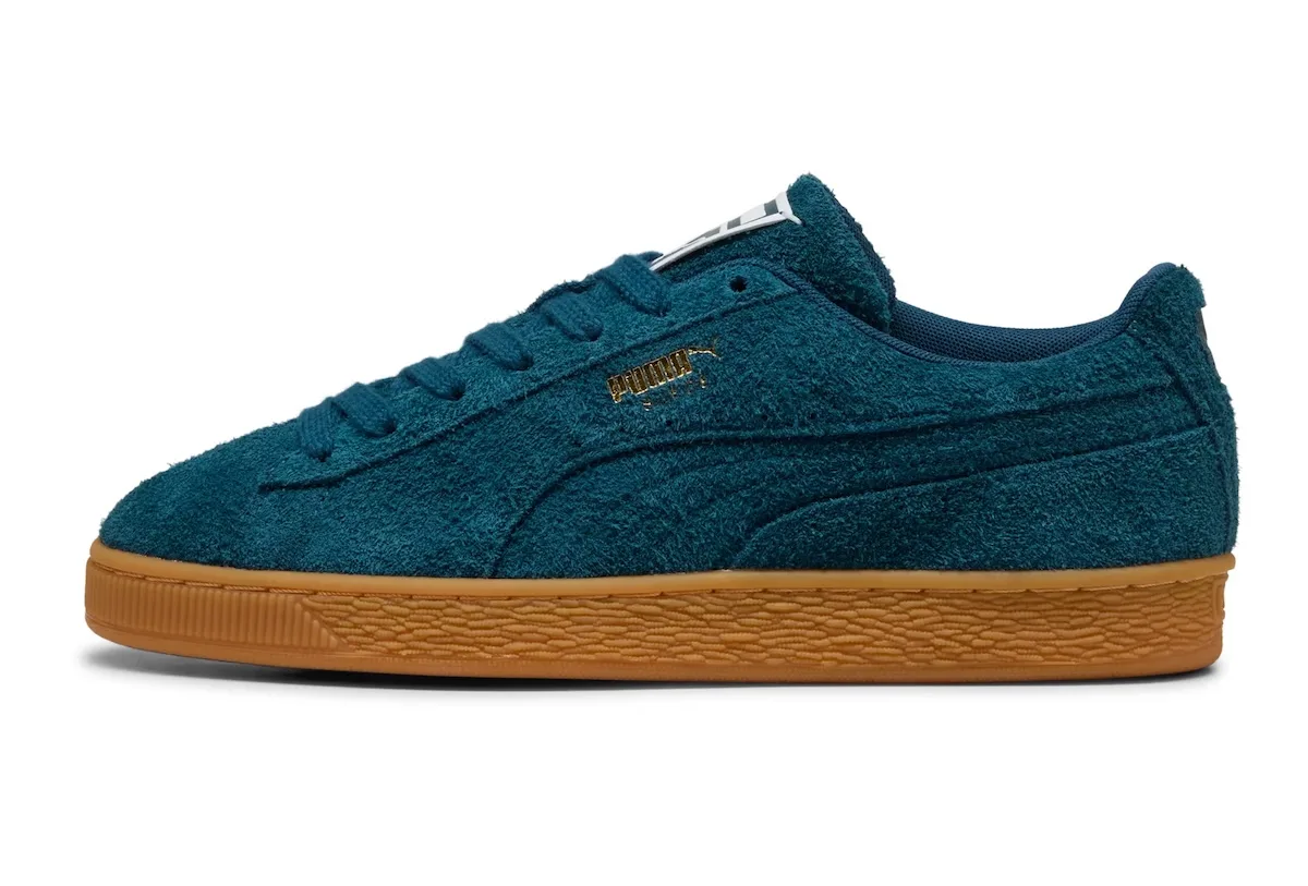 Lateral view of teal shaggy suede with gold Puma branding and a gum sole, Forever