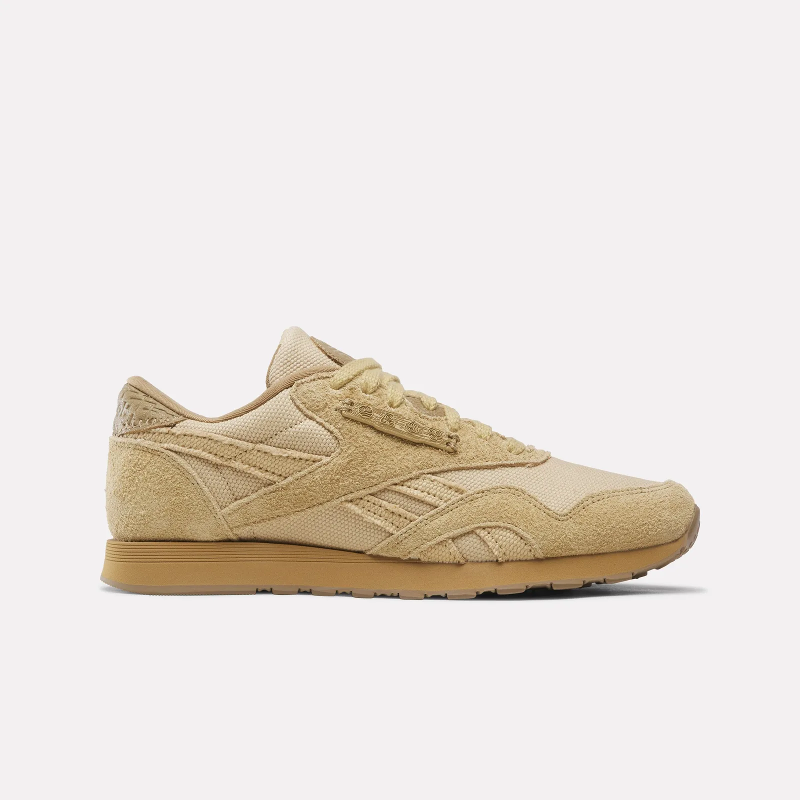 Lateral view in tan suede and canvas, with element-symbol plate on the laces, Four Nations