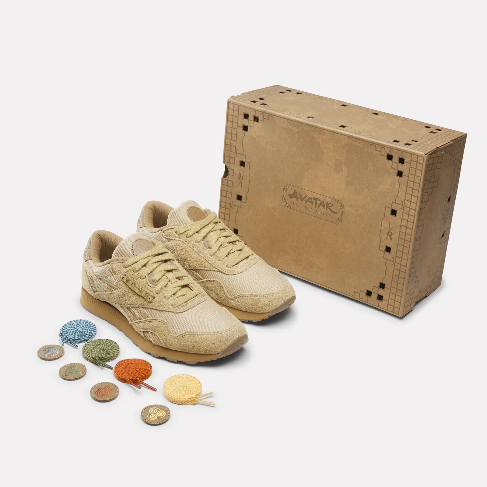 Pair beside a cardboard box with Avatar logo, plus four coloured laces and round patches, Four Nations