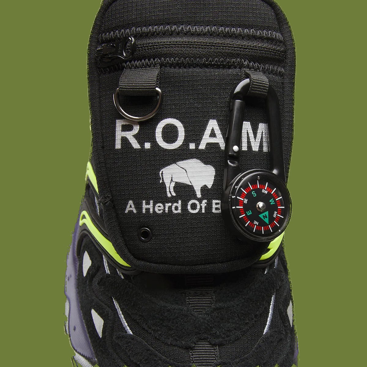 Detail of pocket flap with R.O.A.M bison print, D-ring and carabiner compass, Reebok DMX Trailzilla