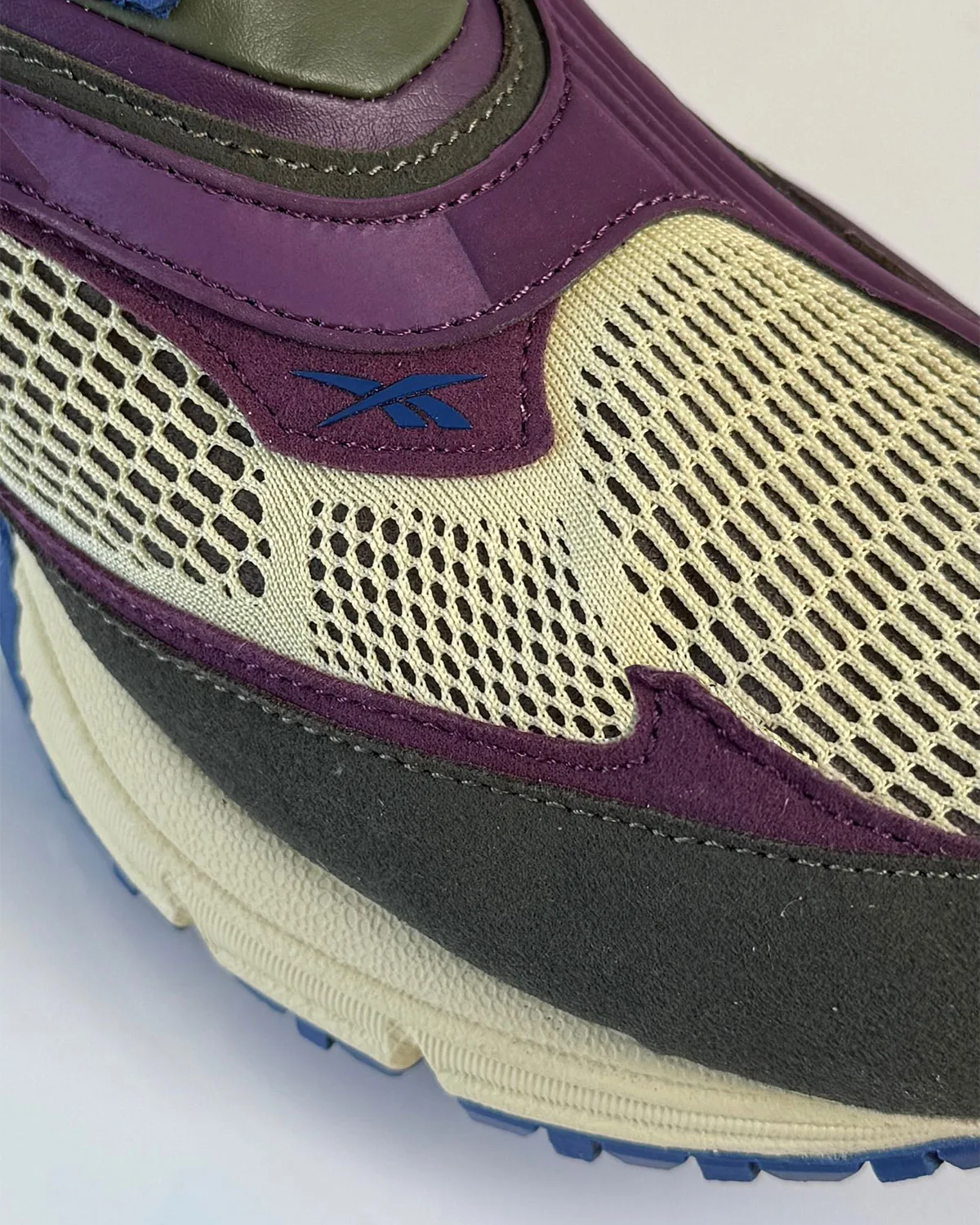 Toe detail: cream mesh with small blue Reebok logo, purple trim and dark olive suede toe cap, Purple Suede