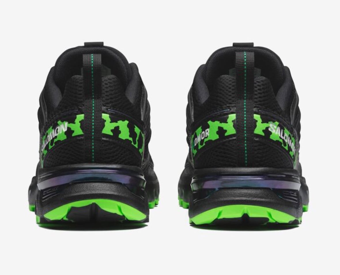 Rear view of the ACS NEXXT pair showing green heel graphics and neon-green outsole sections