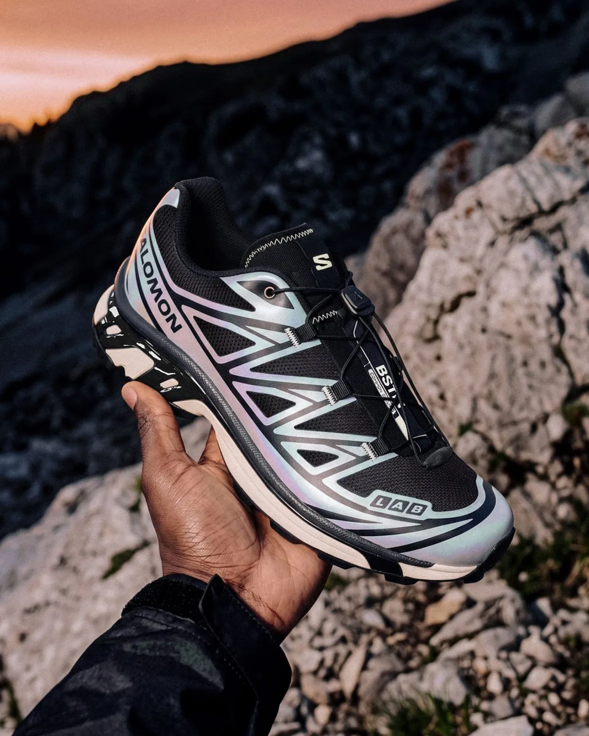 In-hand lateral at sunset, iridescent lilac-blue overlays, rocky mountain background, 5 AM