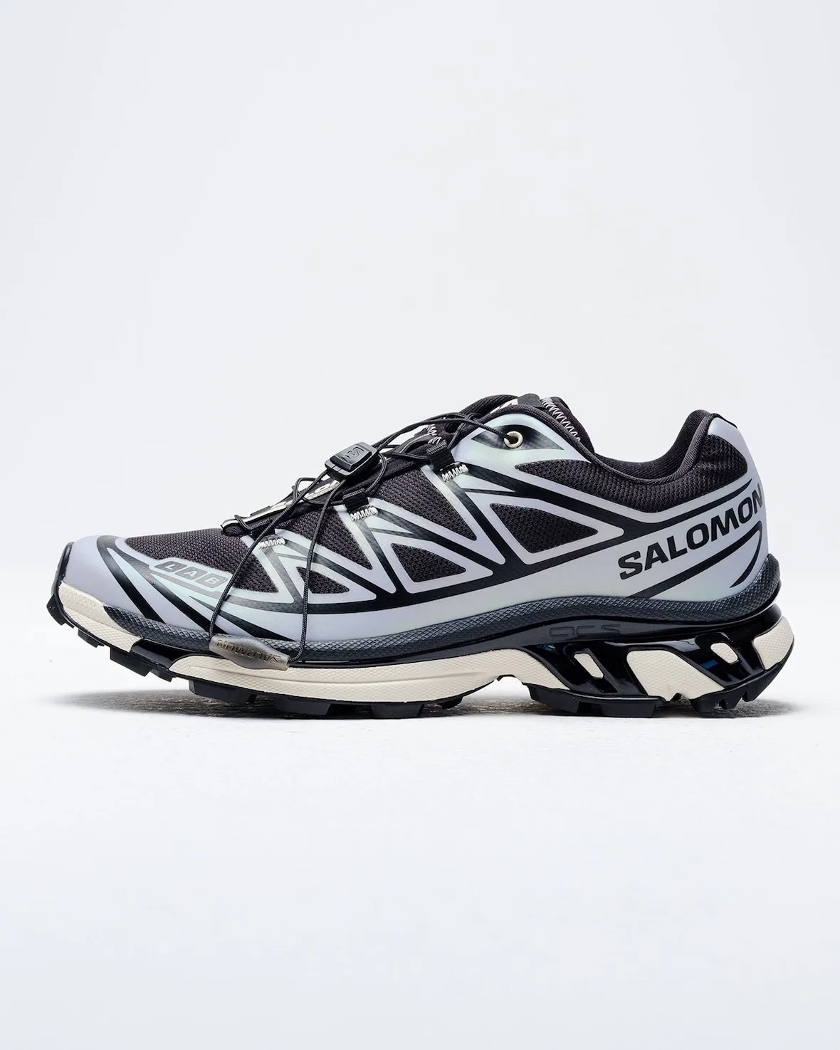 Lateral view on white, lilac-grey and black upper, SALOMON text, cream midsole, 5 AM