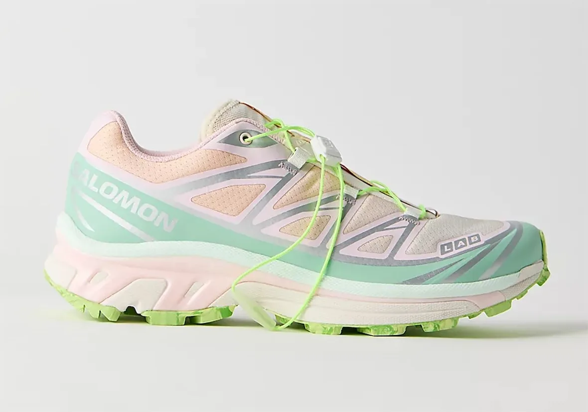 Lateral view of a mint, pink and peach shoe with neon green laces and LAB logo, x FP Movement