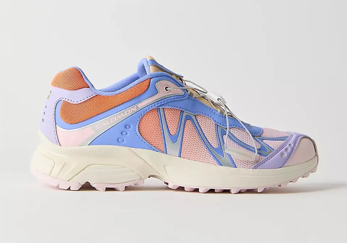 Lateral view of a blue, orange and lilac shoe with pink mesh and cream midsole, x FP Movement