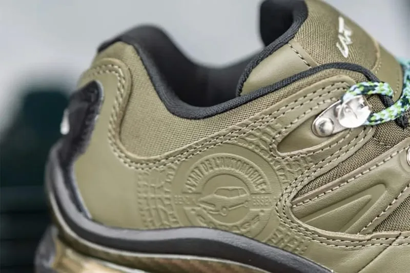 Close-up of olive heel and quarter with embossed car emblem, black collar and mint laces, Olive