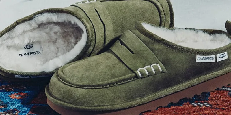 Pair of olive suede loafer clogs on a patterned rug, with JW Anderson and UGG labels and shearling lining, x JW Anderson