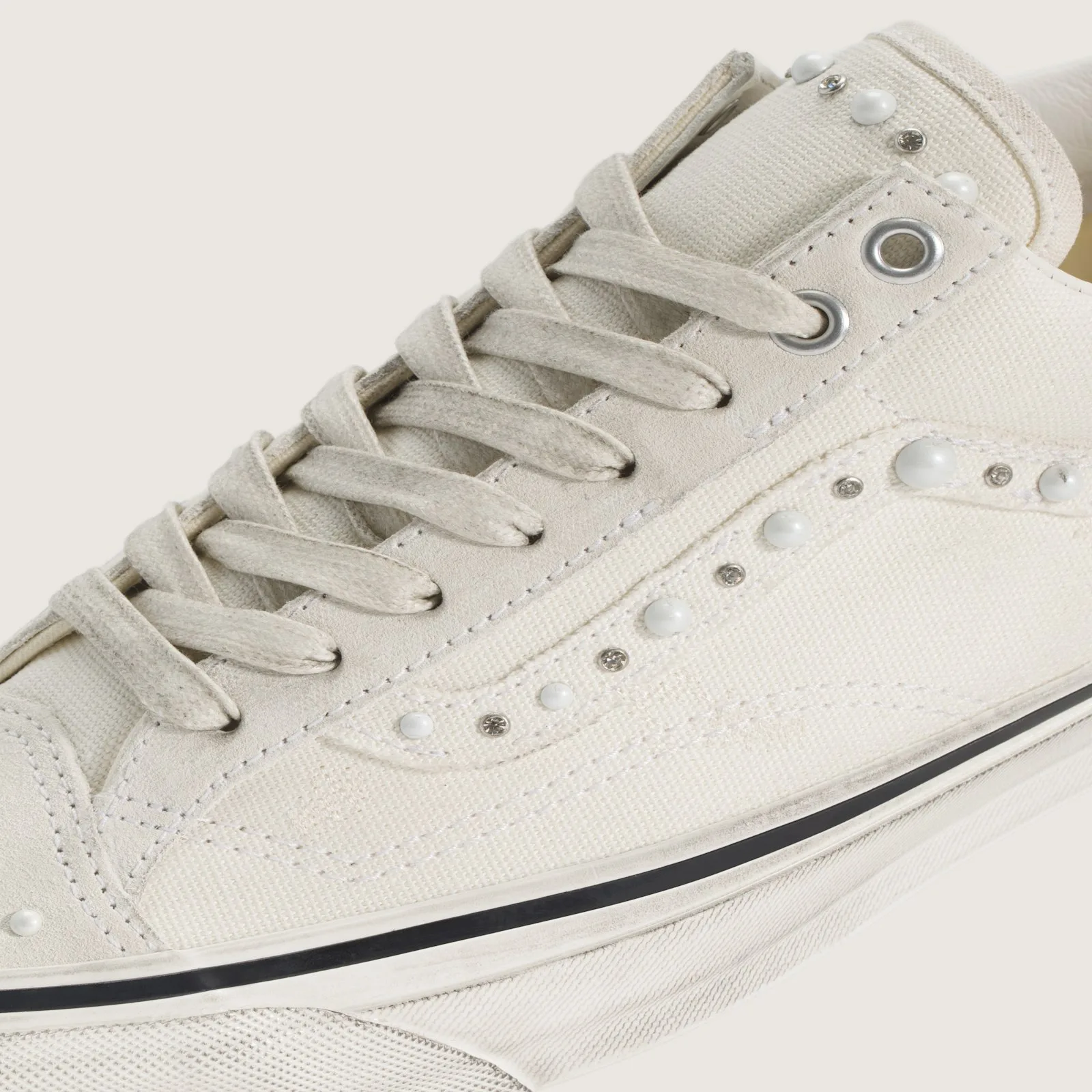 close-up of toe eyelets with pearl and crystal stud detailing on cream canvas, Marshmallow