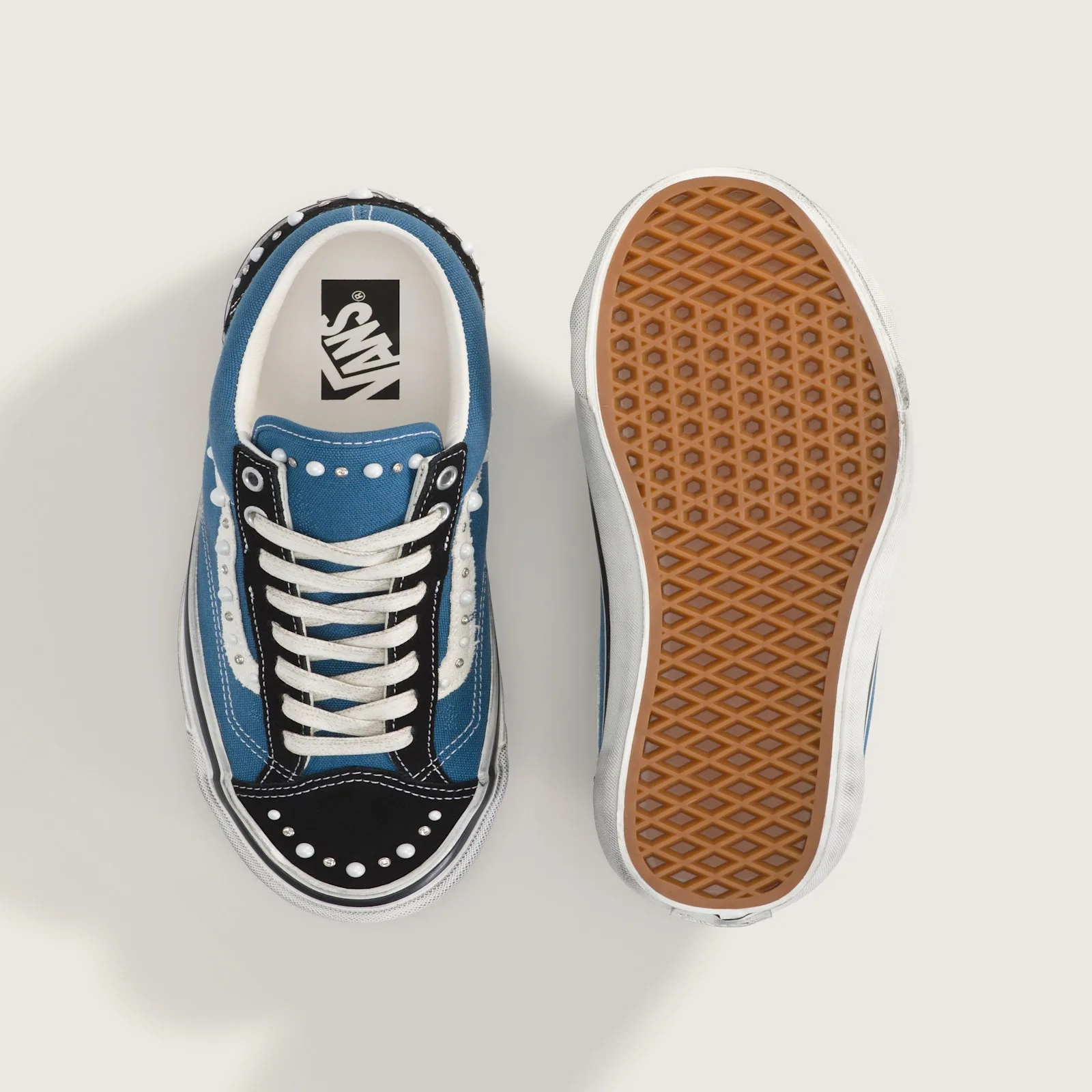 top-down pair beside sole, Vans heel tab and waffle outsole, Navy Blue