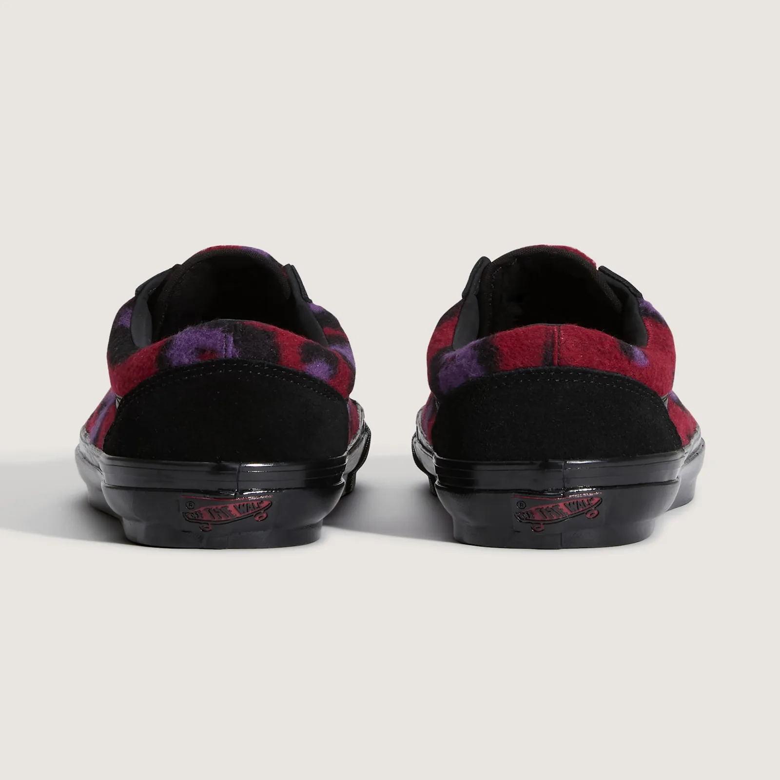 Heel view of the pair, red and purple leopard fleece collars, black suede heel tabs, red Off the Wall logos, Leopard Print