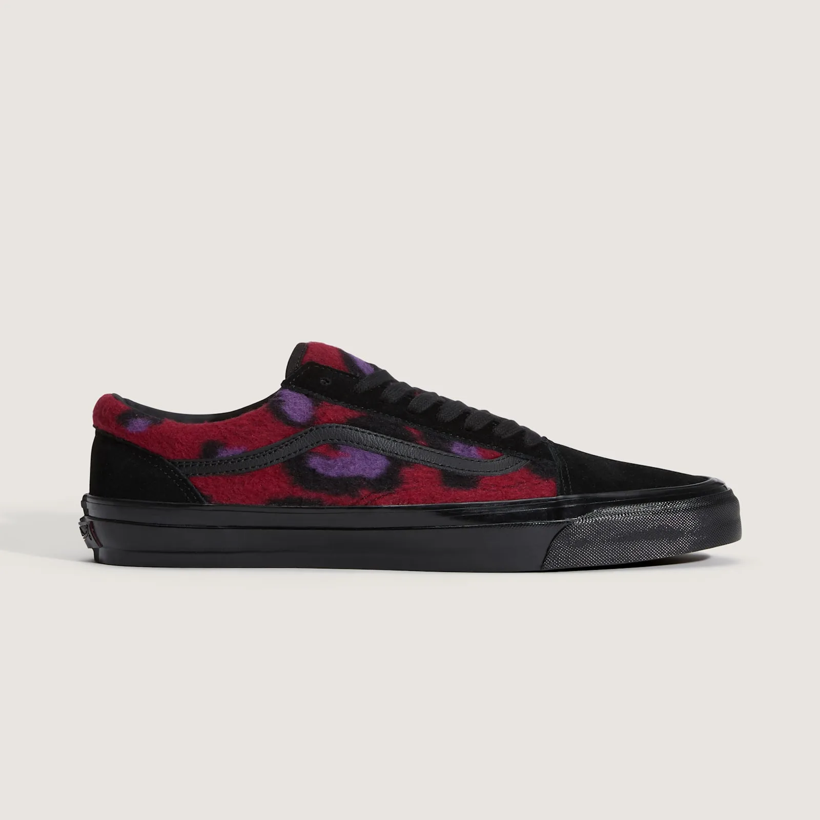 Medial view, red fleece with purple and black leopard spots, black suede toe and heel, glossy black midsole, Leopard Print
