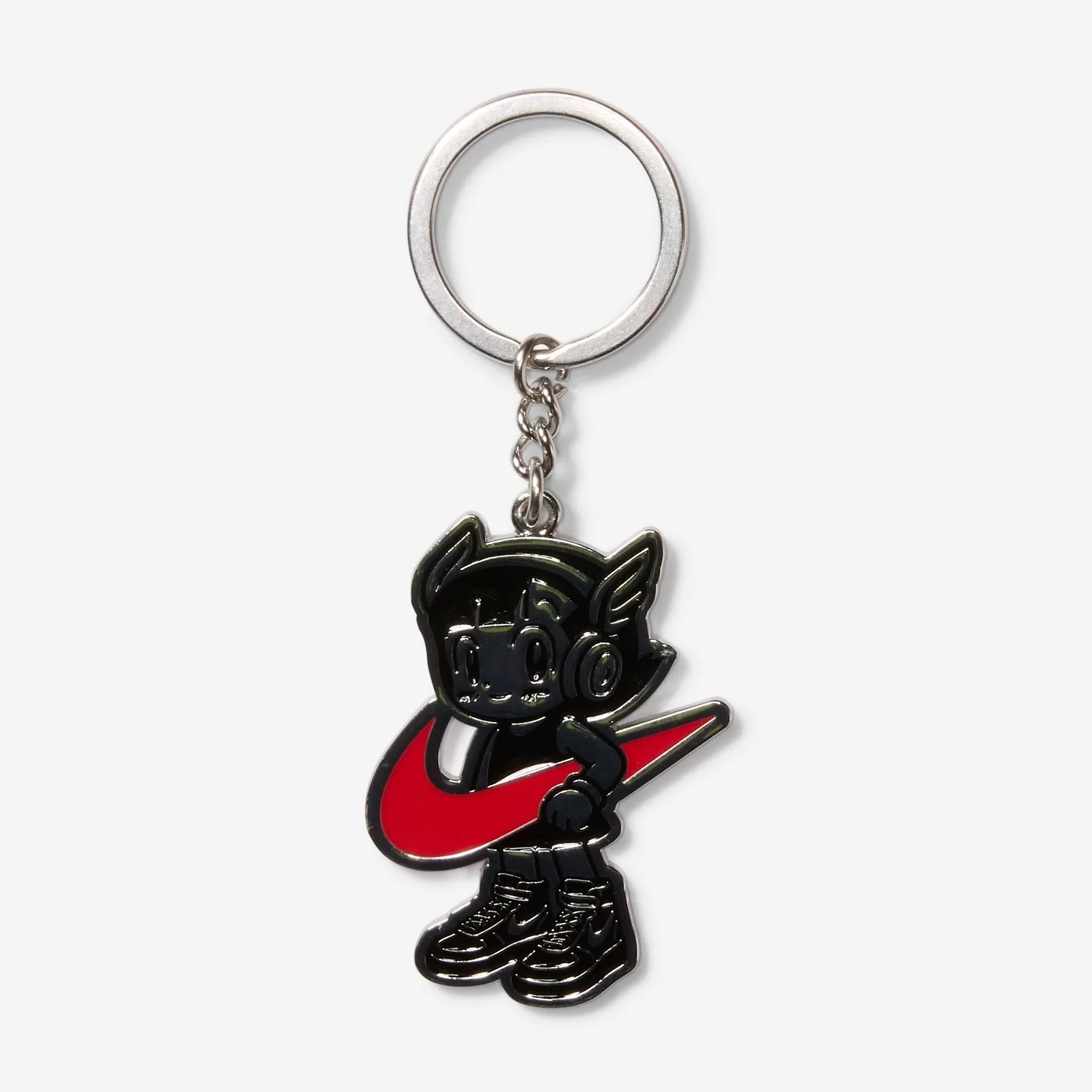 Metal keychain of a black cartoon figure with headphones holding a red swoosh, Black Patent