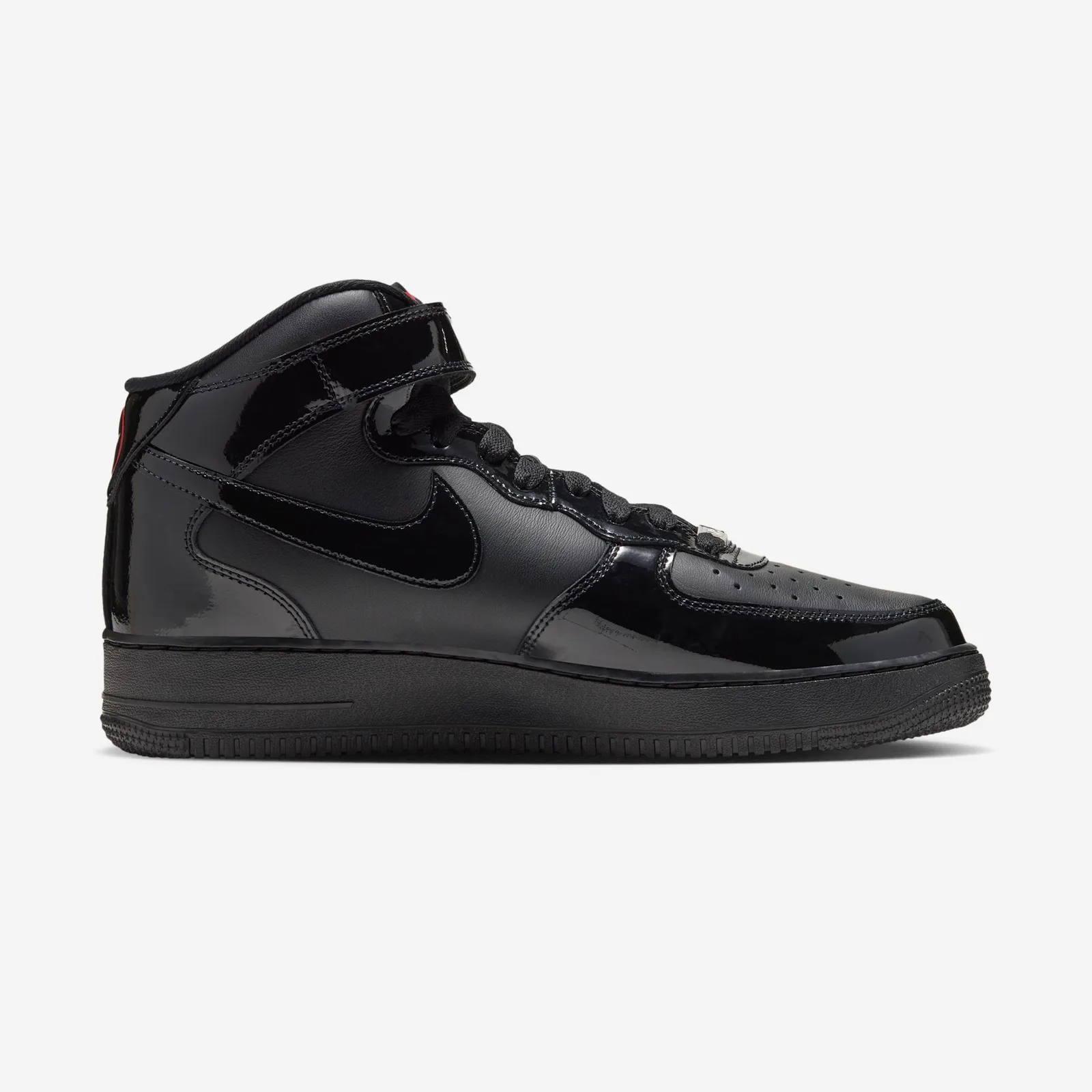 Medial side profile on white, black patent swoosh and strap with a hint of red at the heel, Black Patent